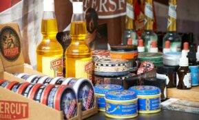 yellow plastic bottle beside blue can