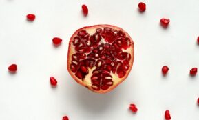 red sliced fruit on white surface