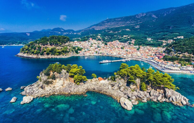 aerial view of green trees and blue sea during daytime