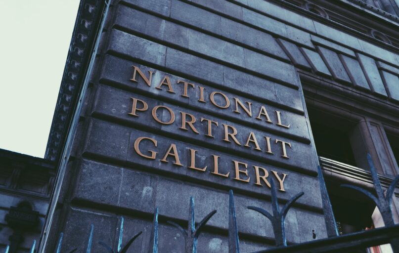 black and brown wooden welcome to the beach signage
