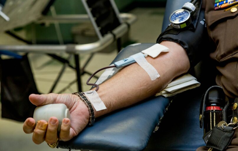 person on chair donating blood