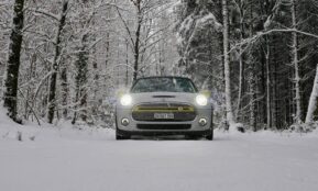 a car driving down a snow covered road