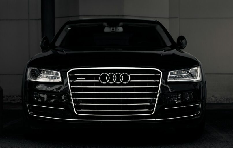 a black and white photo of an audi car