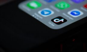 black iphone 4 on black textile