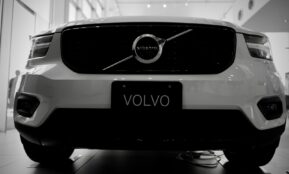 a stove top oven sitting inside of a car