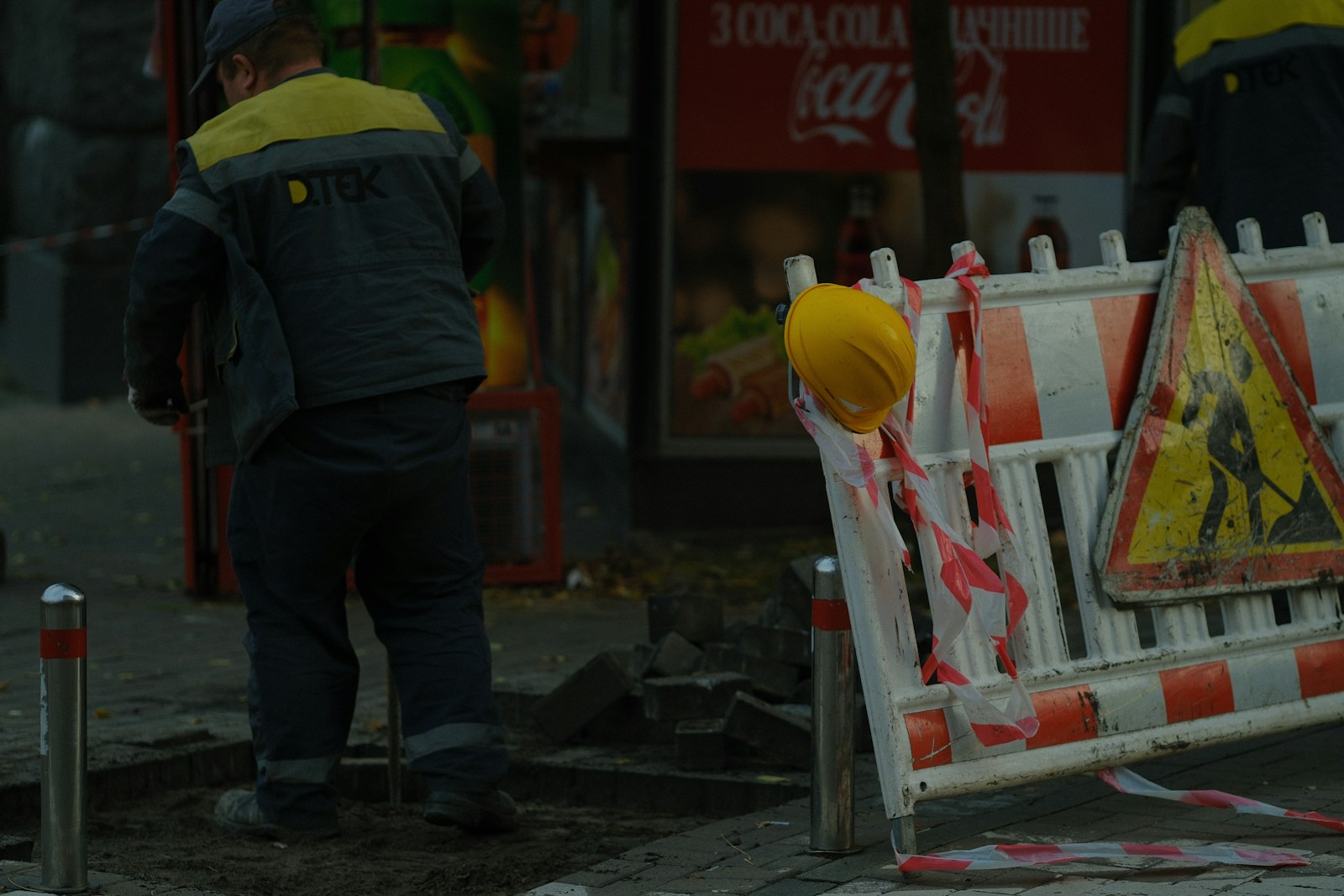 Construction workers and safety barriers on street