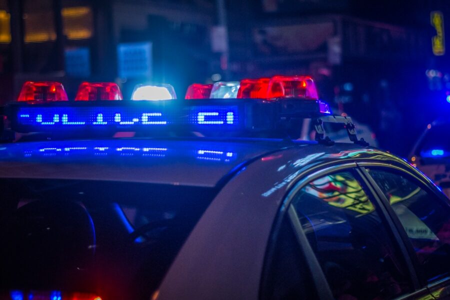 blue car on the street during night time