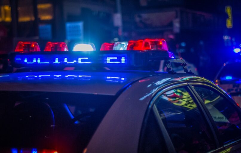 blue car on the street during night time