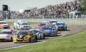 blue and red racing cars on track during daytime