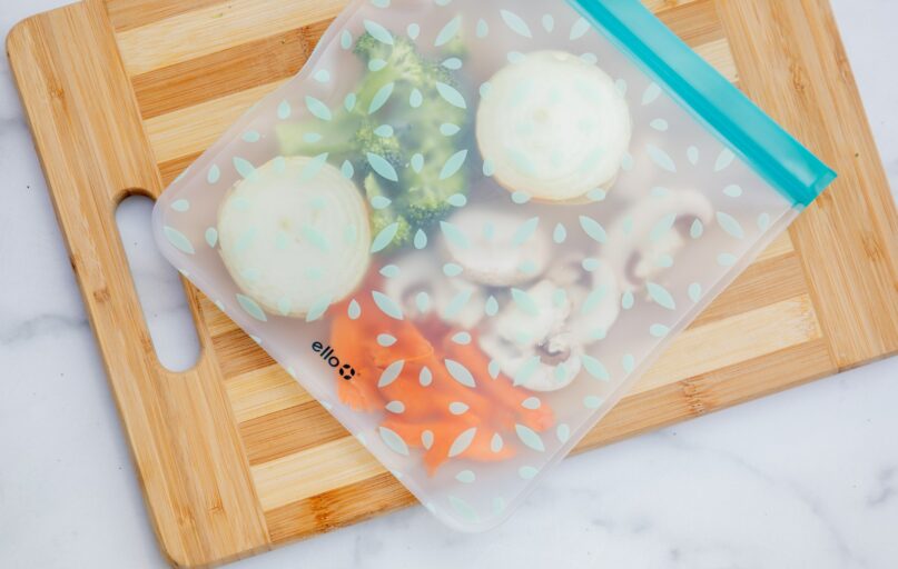 white ice cream on blue plastic container