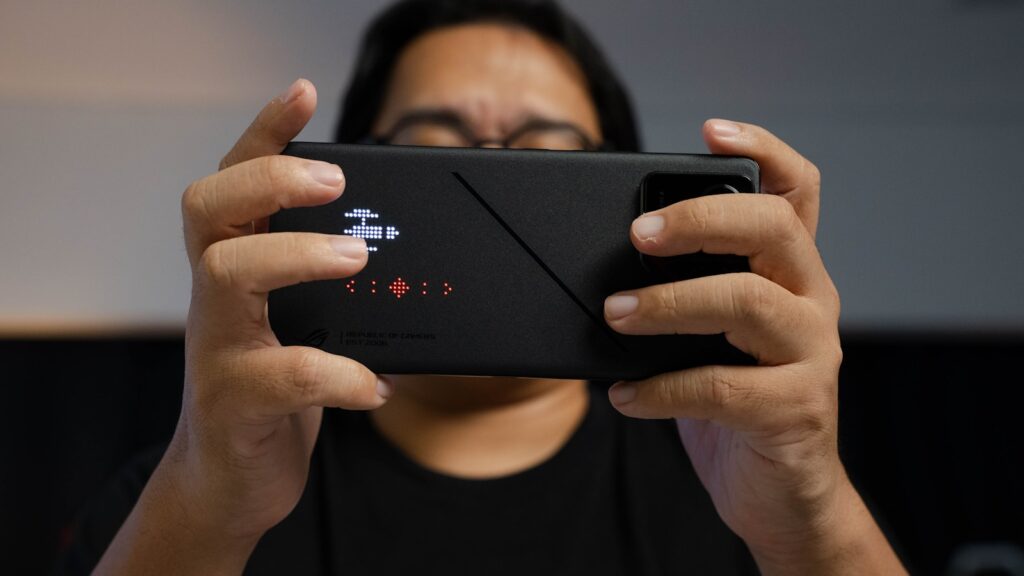 A woman taking a picture with her cell phone