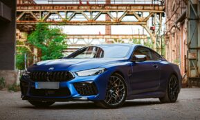 a blue car parked on a street