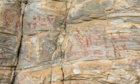 a large rock with some writing on it