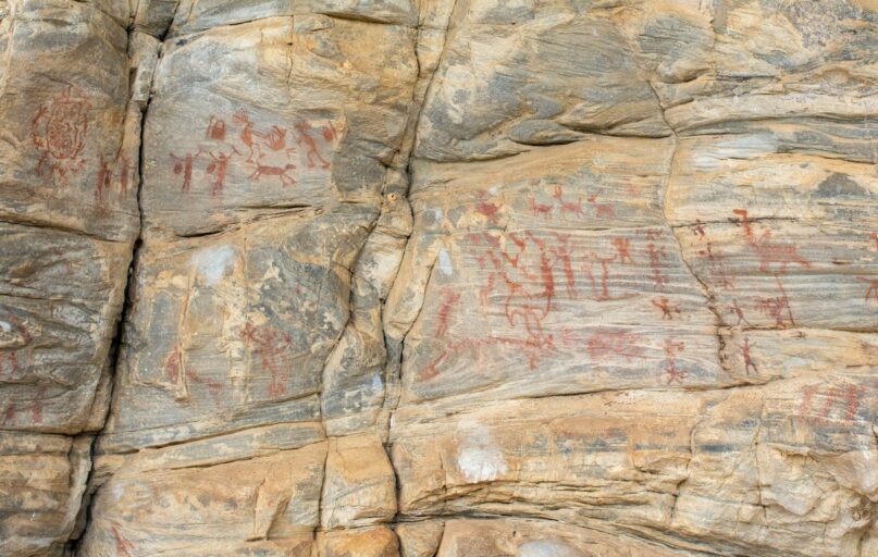 a large rock with some writing on it