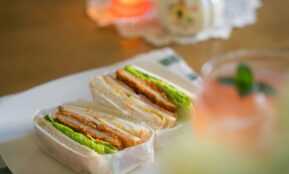 a couple of sandwiches sitting on top of a white plate