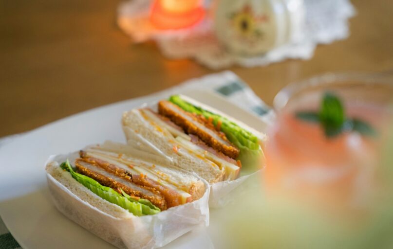 a couple of sandwiches sitting on top of a white plate