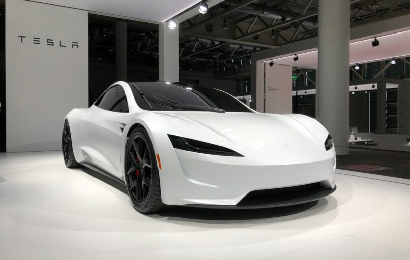 white lamborghini aventador parked in building