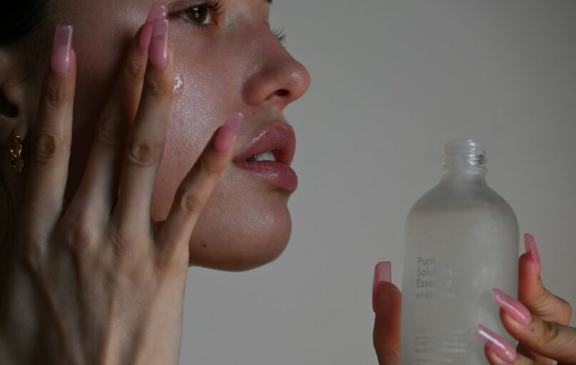 a person holding a bottle