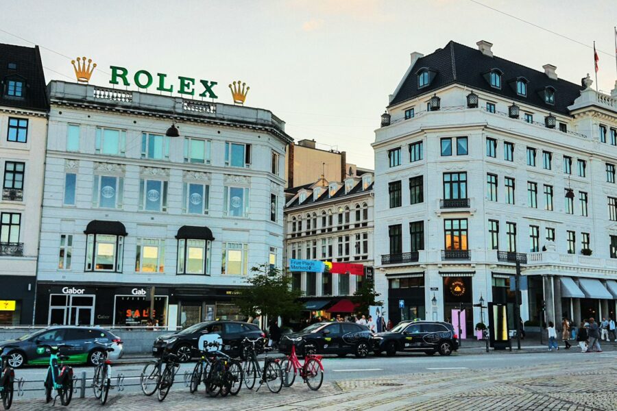 City street with rolex sign and buildings