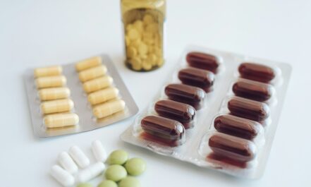 a table topped with pills and a bottle of pills