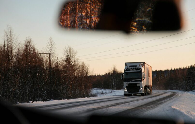 gray cargo truck on road during daytime