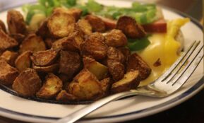 A plate of food with a fork and knife