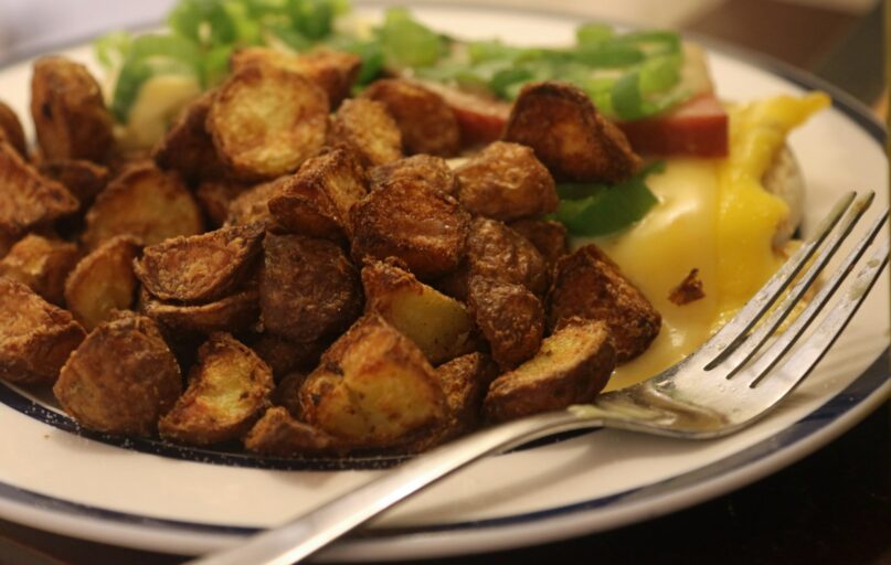 A plate of food with a fork and knife