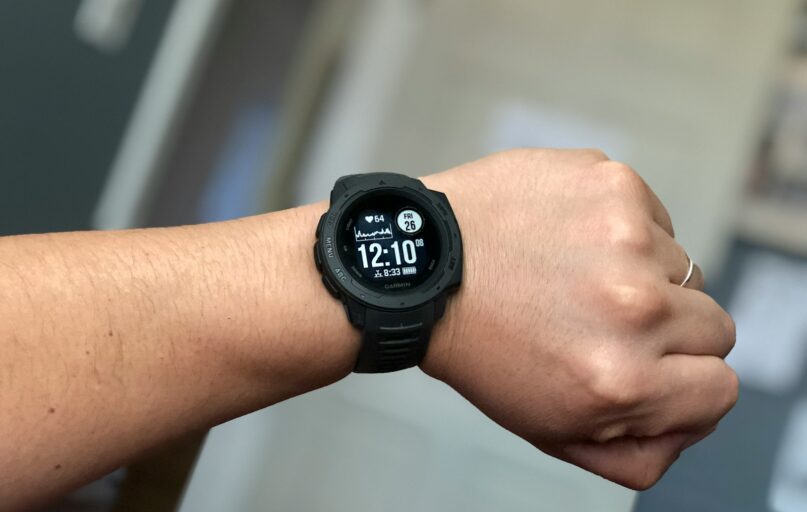 person wearing black digital watch