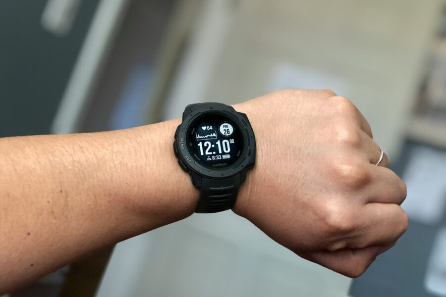 person wearing black digital watch