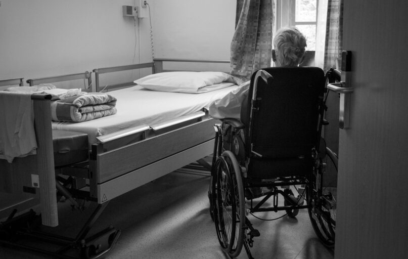 a person in a wheelchair in a room