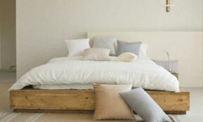 white bed pillow on brown wooden bed frame