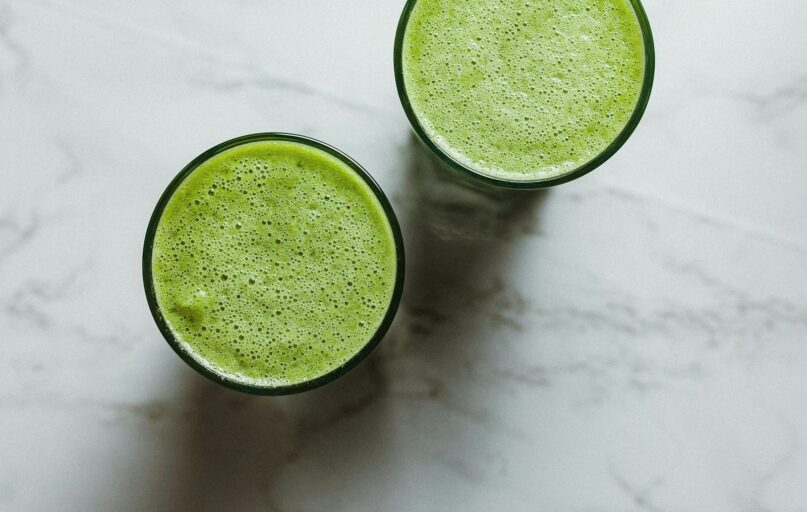2 round green ceramic bowls