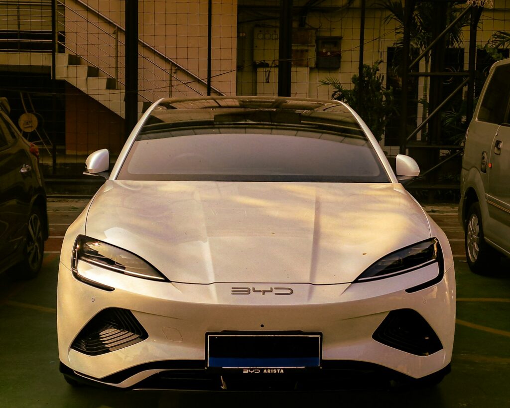 A white sports car parked in a parking lot