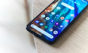 black android smartphone on brown wooden table