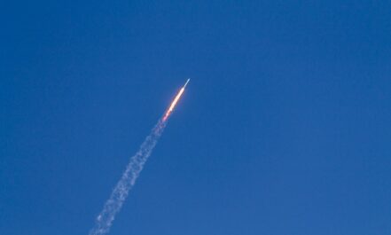 flying rocket during daytime