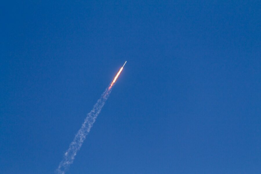 flying rocket during daytime