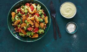 stainless steel fork beside white ceramic bowl with food