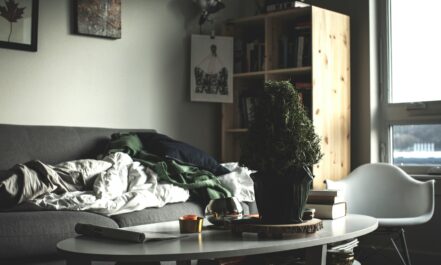 oval white wooden coffee table near vacant sofa