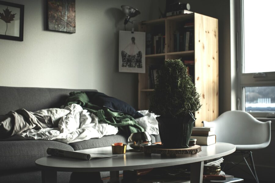 oval white wooden coffee table near vacant sofa