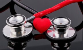 a stethoscope and a heart on a table