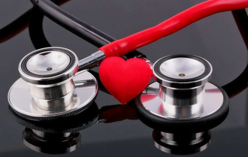 a stethoscope and a heart on a table
