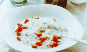 a bowl of rice with a spoon in it