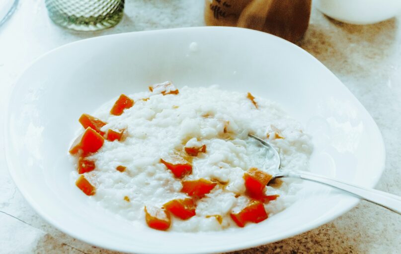 a bowl of rice with a spoon in it