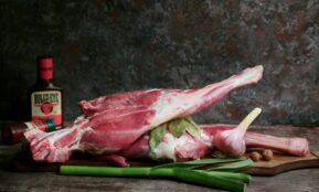 a piece of meat sitting on top of a cutting board