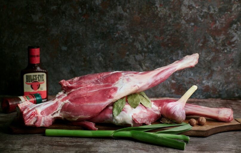 a piece of meat sitting on top of a cutting board