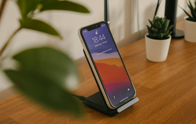 black android smartphone on brown wooden table