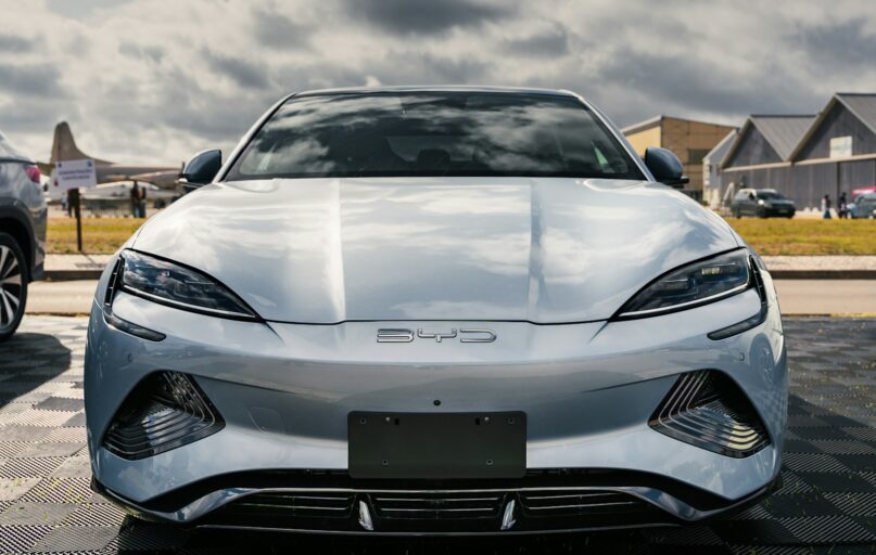 A silver sports car parked in a parking lot