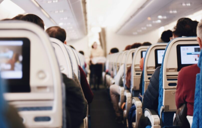 shallow focus photography of people inside of passenger plane