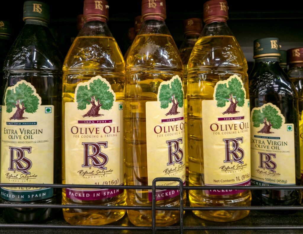 Bottles of olive oil on a shelf