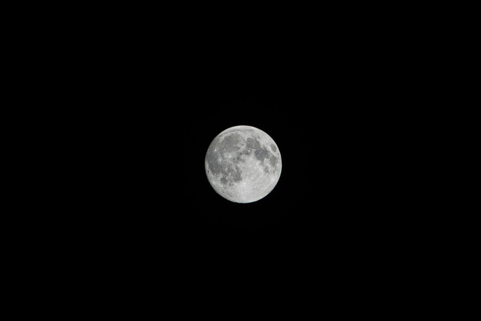 Crisp image of the full moon captured against a black night sky.